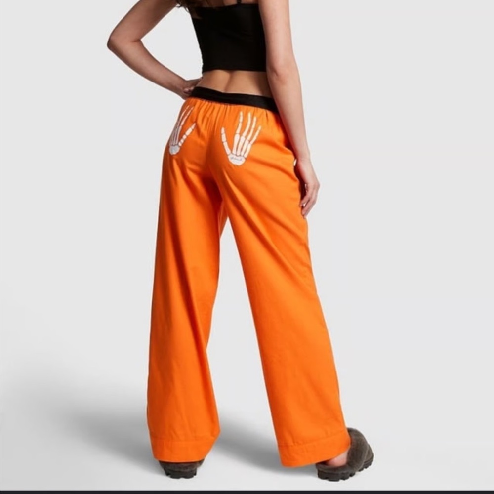 PINK Victoria's Secret Orange Flannel Pajama Pants with Skeleton hands design